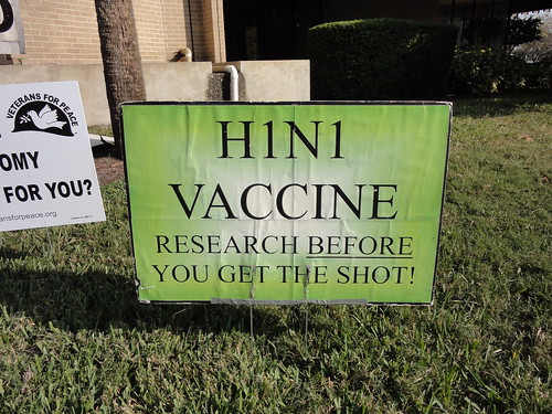 An anti-vaccine sign at the Occupy Orlando rally