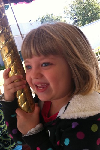 happy Catie on the merry-go-round