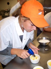 Oxford Hills Technical School student Haylee Chute puts the finishing touches on a dessert.
