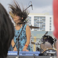 picture three of three of Yuki Chikudate's at the keyboards, her hair blowing up