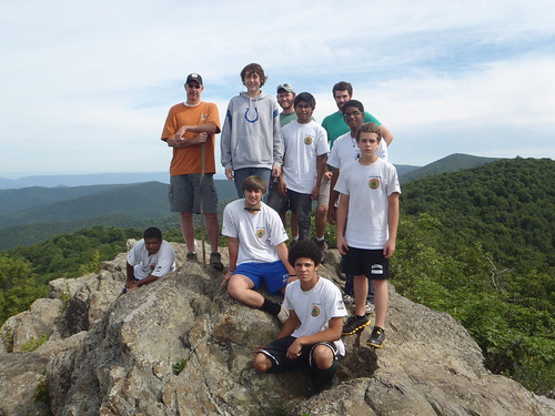Park Manager Tony Widmer (orange shirt) poses with the Shenandoah River State Park YCC crew in the obligatory "crew stands on rocks" picture for programs in the mountain parks. 