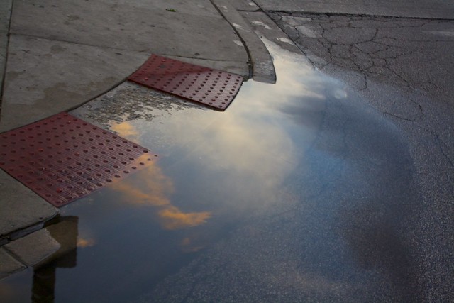 Sunset in a flooded gutter