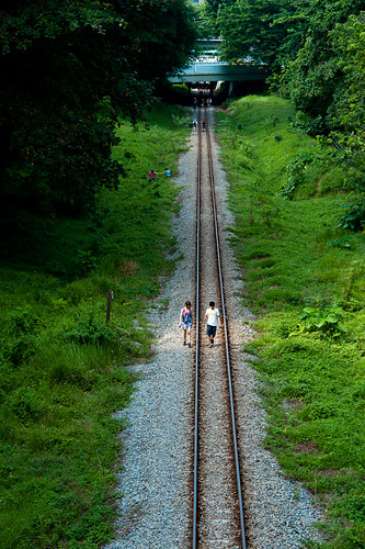 Couple along the tracks