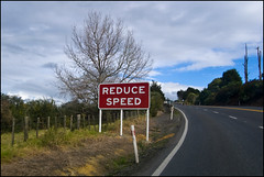 Reduce Speed road sign
