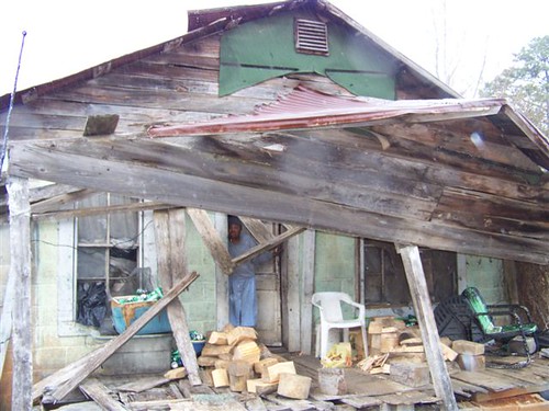 The “before” photo of the old home of Ms. Monger in Grenada, which was a hazard.