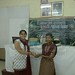 Ishita giving the prize for the best content for the Project Enhance students