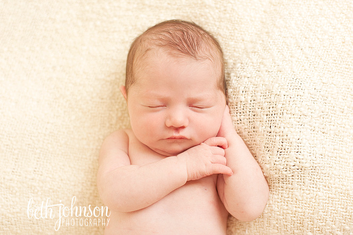 newborn baby girl on cream blanket in tallahassee
