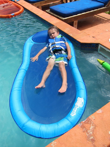 Ezra relaxes on the floaty