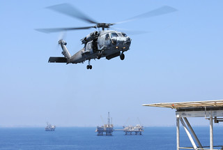 An HH-60H Sea Hawk helicopter prepares to land...