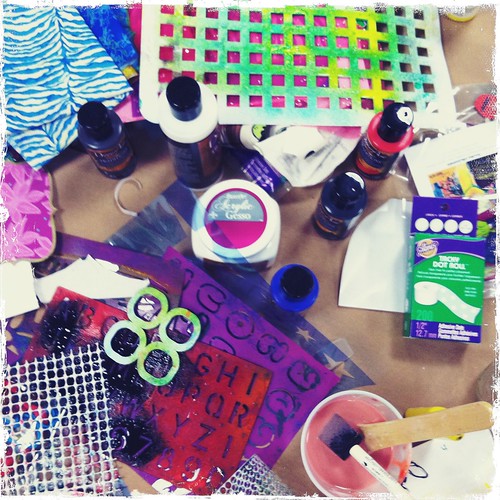 a table full of mixed media goodies at my artJOURNALING daily workshop