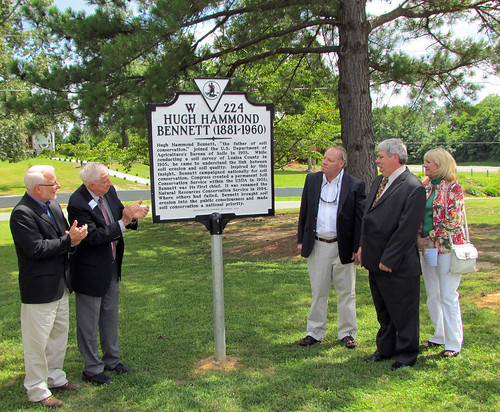 NRCS Chief Dave White and Dr. Maurice Cook applaud as Hugh Hammond Bennett, III, his wife Nina Bennett, and his brother, Robert Bennett view the newly unveiled historical marker.