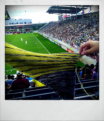 Knitting at the rapids game, paying the rain holds off