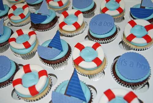 nautical themed baby shower cupcakes - sailboats, life preservers