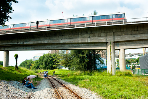 A MRT train rumbles above the old KTM tracks