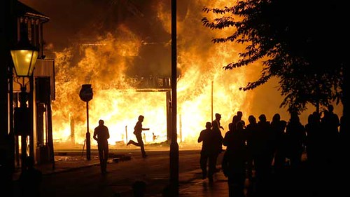 Building set alight by youth in England in the aftermath of the police killing of Mark Duggan, a Black youth from Tottenham who was shot dead by the Metropolitan Police. by Pan-African News Wire File Photos
