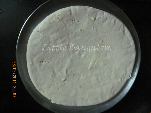 Pizza base with butter spread out