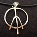 Wire wrapped, domed, soldered peace sign on leather