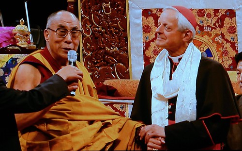 Cardinal Donald Wuerl, the Archbishop of Washington D.C. welcomes His Holiness the 14th Dalai Lama,  speaking about the ecumenical spirit, holding hands, after giving the Cardinal a khata, Kalachakra for World Peace, Verizon Center, Washington D.C., USA by Wonderlane