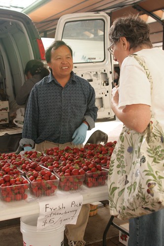 “NIFA’s Beginning Farmer and Rancher Development Program funds projects to help train individuals in areas like agribusiness. Here, a program participant sells his goods at a farmer’s market in Minnesota. ” (Photo credit: Hli Xyooj)