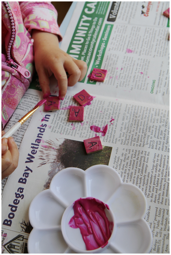 Painting scrabble letters with pink paint
