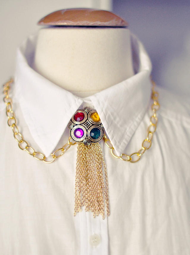 gilded necklace  with  gemstones and gold chains