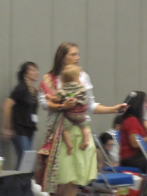 BlogHer Mic Wrangler wearing a baby