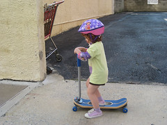 Speck on new skateboard, with helmet and elbow pads