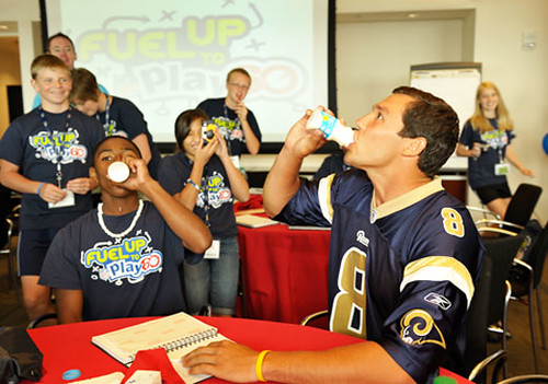St. Louis Rams quarterback Sam Bradford challenges Fuel Up to Play 60 participants to a milk drinking competition during the Student Ambassador Summit in Washington, D.C. (Photo Courtesy of fueluptoplay60.com)