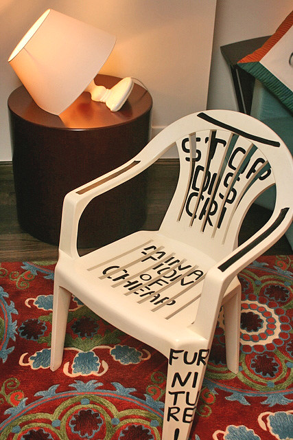 This is not a plastic chair. It's solid wood! Check out the semi-submerged lamp too!