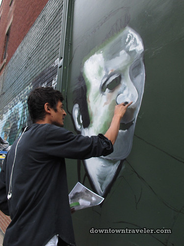 REUBEN PETER FINLEY creating street art mural in Montreal