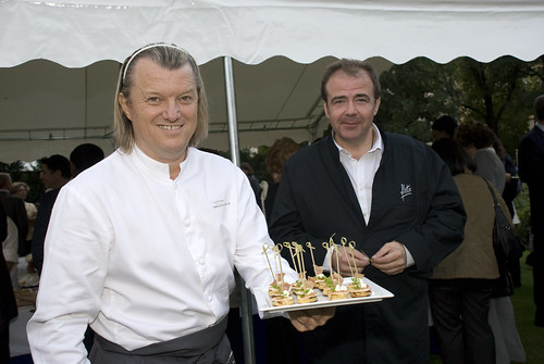 Chefs Philippe Bohrer and Eric Salmon presenting U.S. style mini pancakes with bacon and Persil (from the garden)