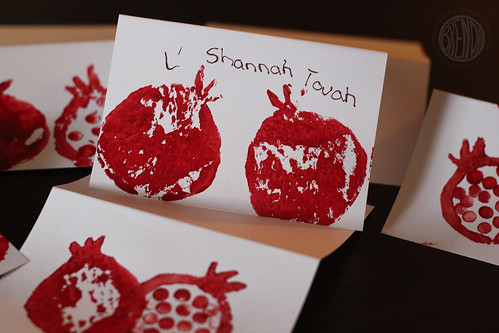 picture of kidmade Rosh Hashanah cards with painted pomegranates and wishes for L' Shana Tovah