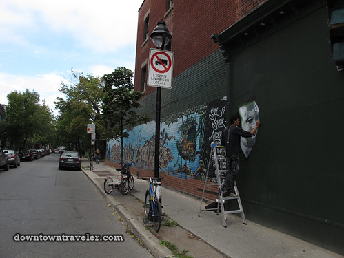 REUBEN PETER-FINLEY working on street art mural in Montreal