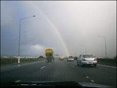 Driving on SH16 with a rainbow
