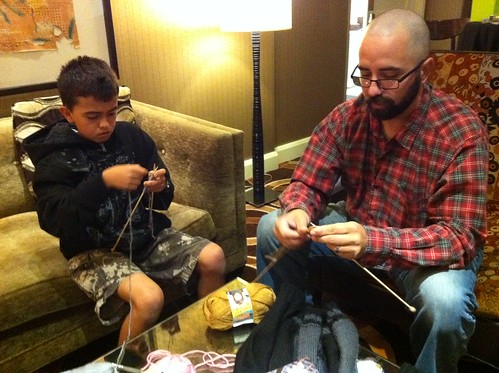 Cement truck driver/ knitter brought his son to the Beginner Lounge to learn. Love it! #VKLive