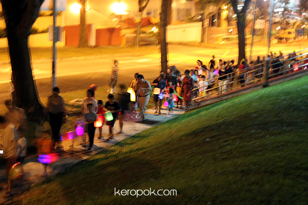 Kids carrying lanterns...