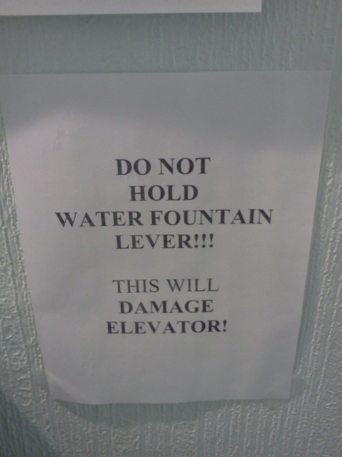 DO NOT HOLD WATER FOUNTAIN LEVER!!! THIS WILL DAMAGE ELEVATOR!