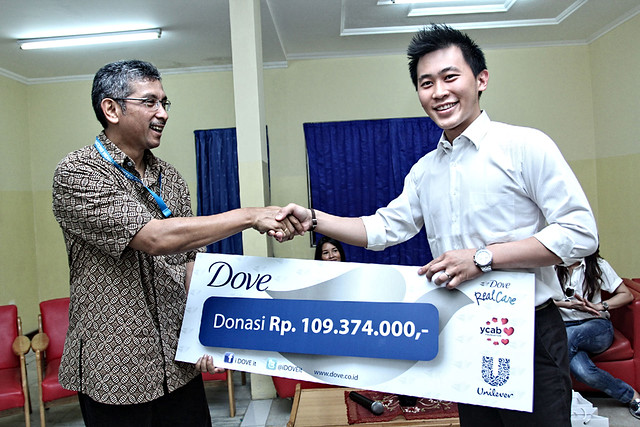 Symbolized Donation from Dove to YCAB