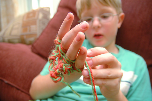 day 2625: wherein odin attempts to teach me advanced finger knitting.