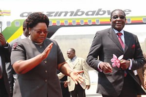 Republic of Zimbabwe Vice-President Joice Mujuru welcoming President Robert Mugabe to Harare International Airport on October 2, 2011. Mugabe had been in Singapore. by Pan-African News Wire File Photos