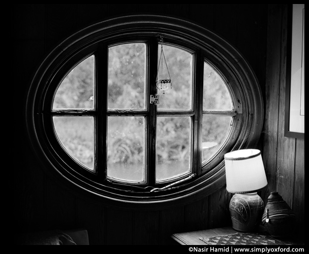 Oval wooden window