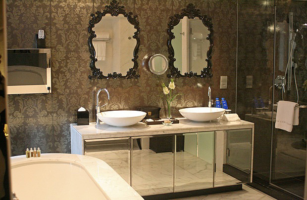Twin basins, full bath and shower at the Royale suite