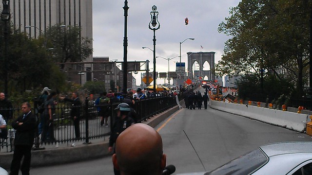 Police following after #OccupyWallStreet on the Brooklyn Bridge