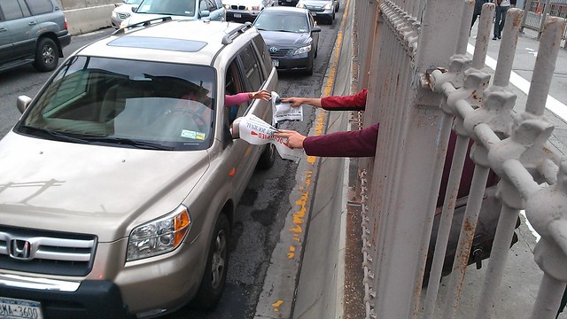 Handing out #OccupyWallStreet Journals to drivers on the Brooklyn Bridge
