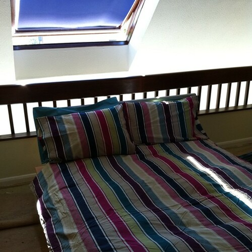 Sunny bed with clean sheets