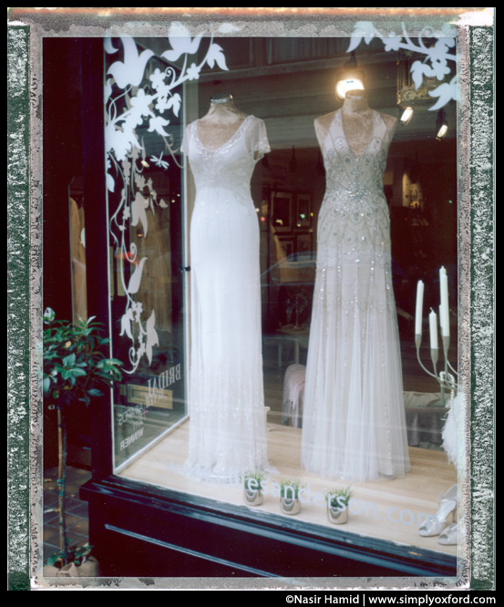 Elegant dresses in shop window