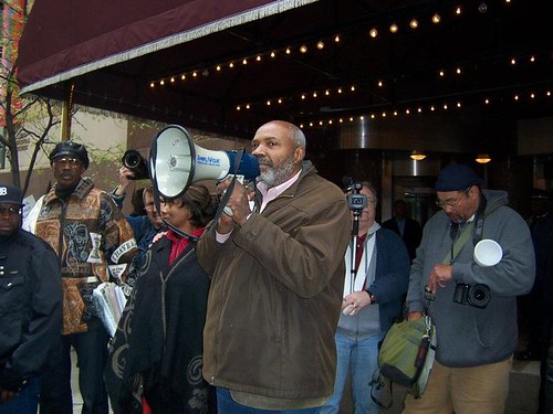 Abayomi Azikiwe, editor of the Pan-African News Wire, covering the demonstration against Bank of America on October 21, 2011. Occupy Detroit adopted the Moratorium NOW! demand for a halt to foreclosures. by Pan-African News Wire File Photos
