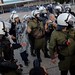 Platoon of riot police attempt to detain woman protester - Thessaloniki Trade fair, Greece