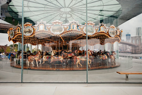 Looking at the Carousel, you can see the Brooklyn Bridge in the background.