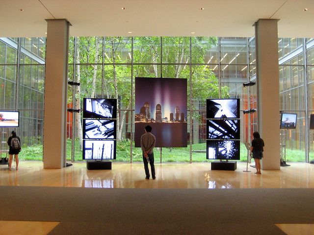 Three exhibits near the building's center atrium